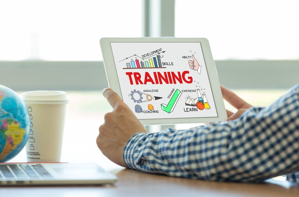 man reading a tablet with training written on it