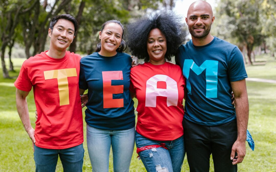 group of people wearing shirts spelled team