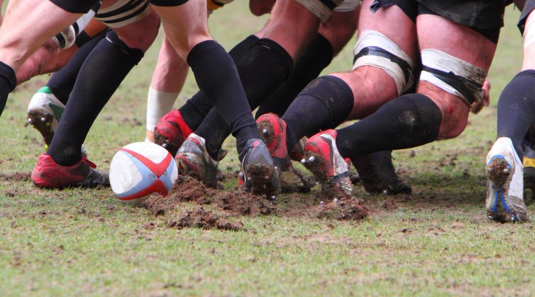men playing rugby in a ruck