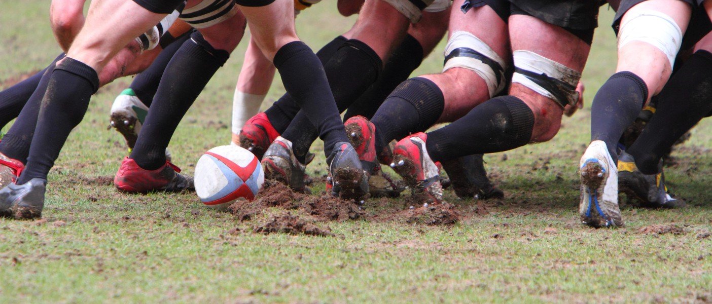 men playing rugby in a ruck
