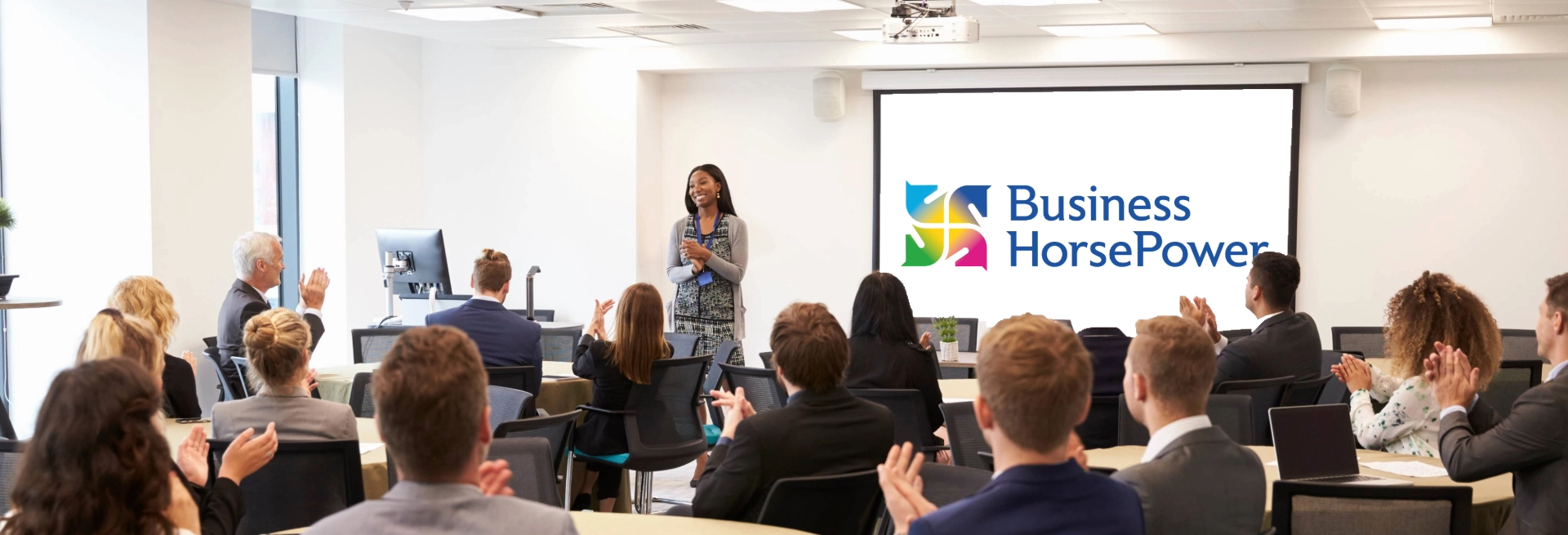 Julia standing infront of an audience