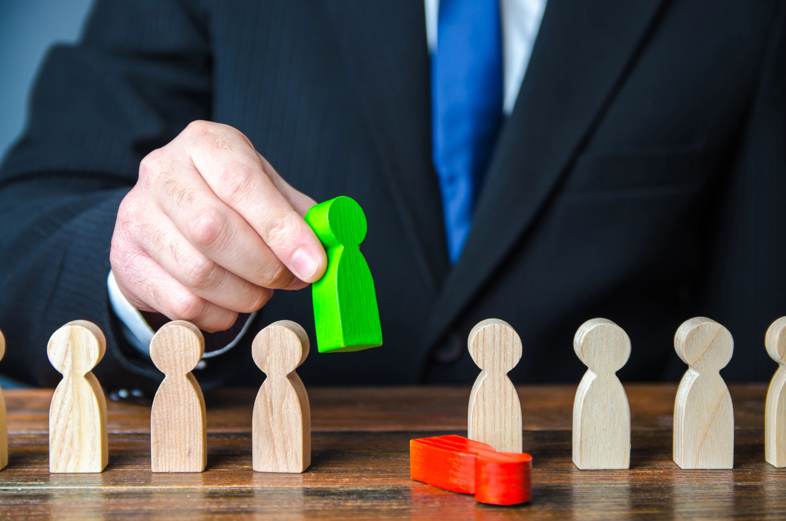 Businessman kicks out a team member and replaces with another one