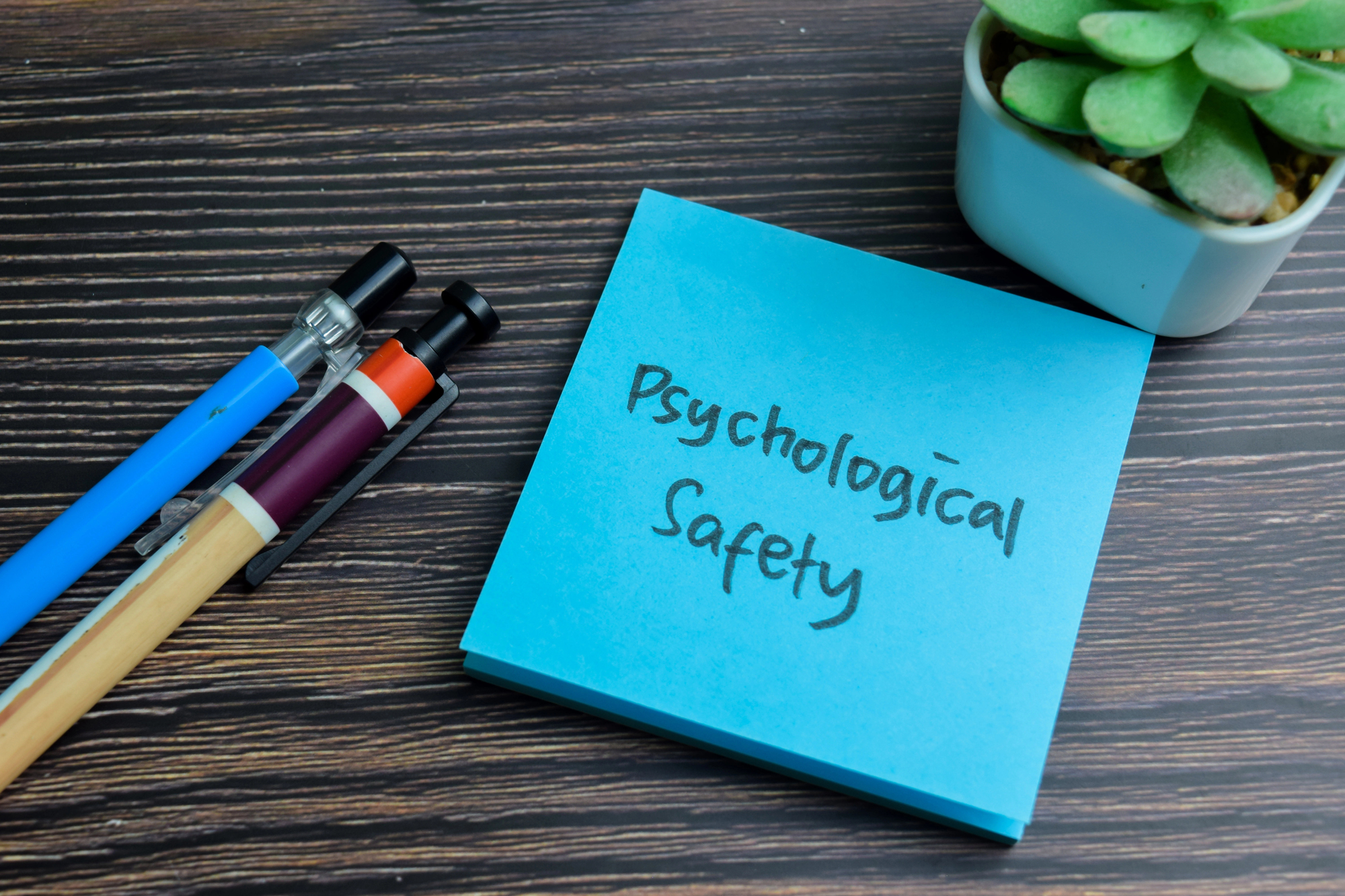 word psychological safety on a post it note